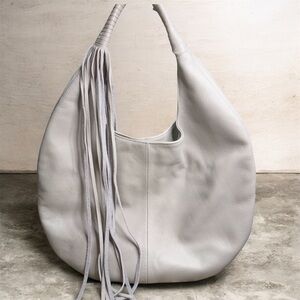 Anthropologie’s B Low The Belt Grey Leather Fringe Shoulder Bag